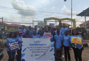 L-R: 4th at the front row: Dr Ajibola Abayomi, President Journalists International Forum For Migration (JIFORM), Mrs Abosede Mary Otukpe, the Cordinator of the Nigerian Women Association (NWA) and other members of the association during the campaign against irregular migration at Igando, Lagos State Nigeria on April 12, 2022.